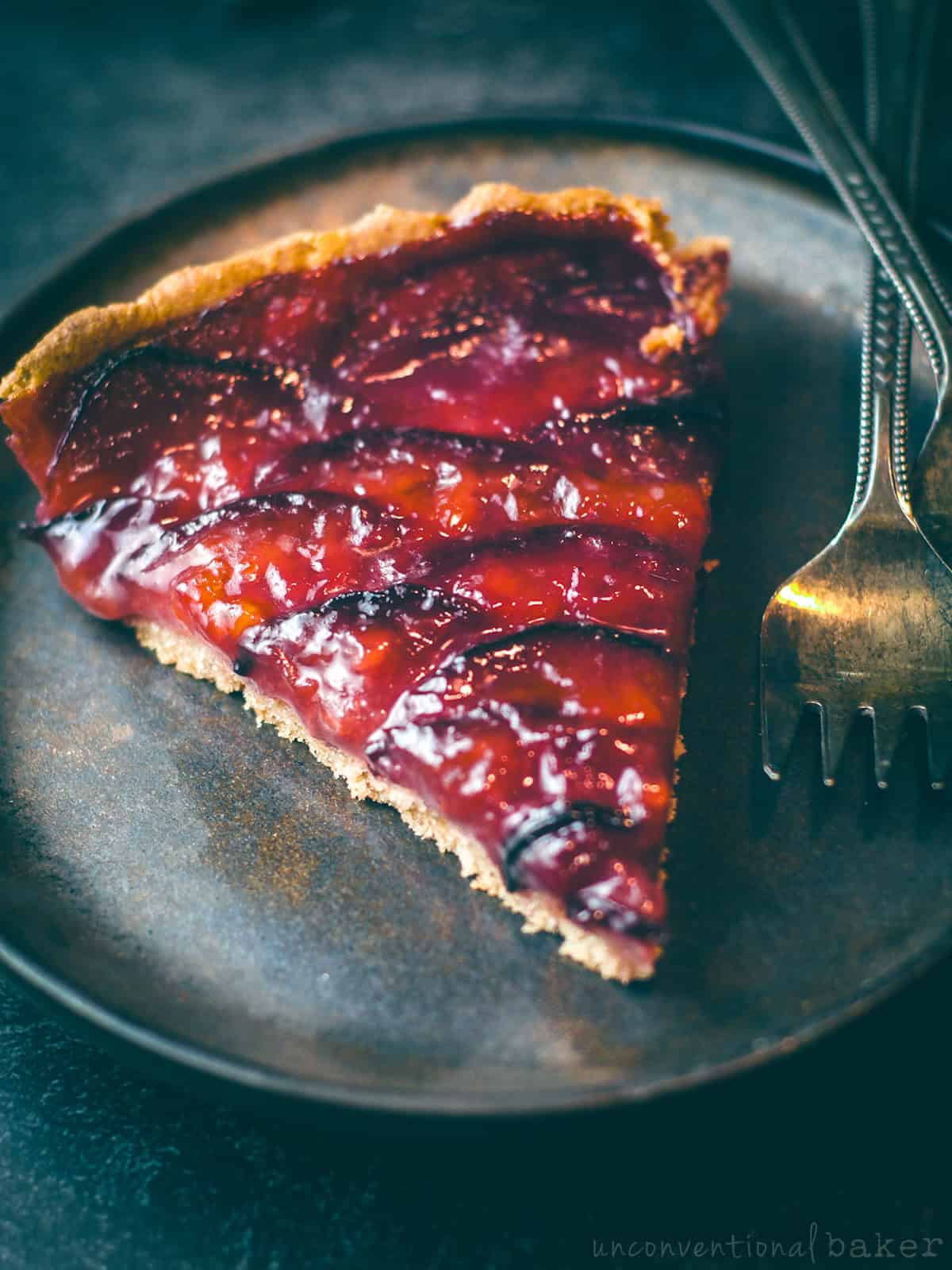 Slice of vegan gluten-free plum tart